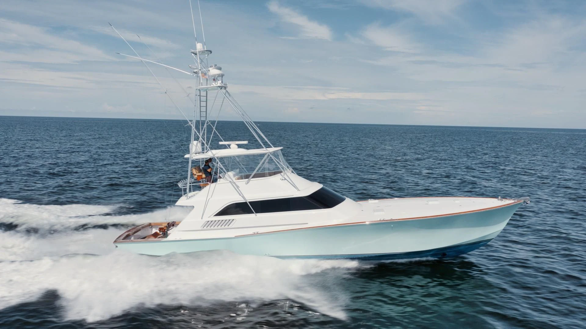 a white boat in the water aboard PAST TIME Yacht for Sale
