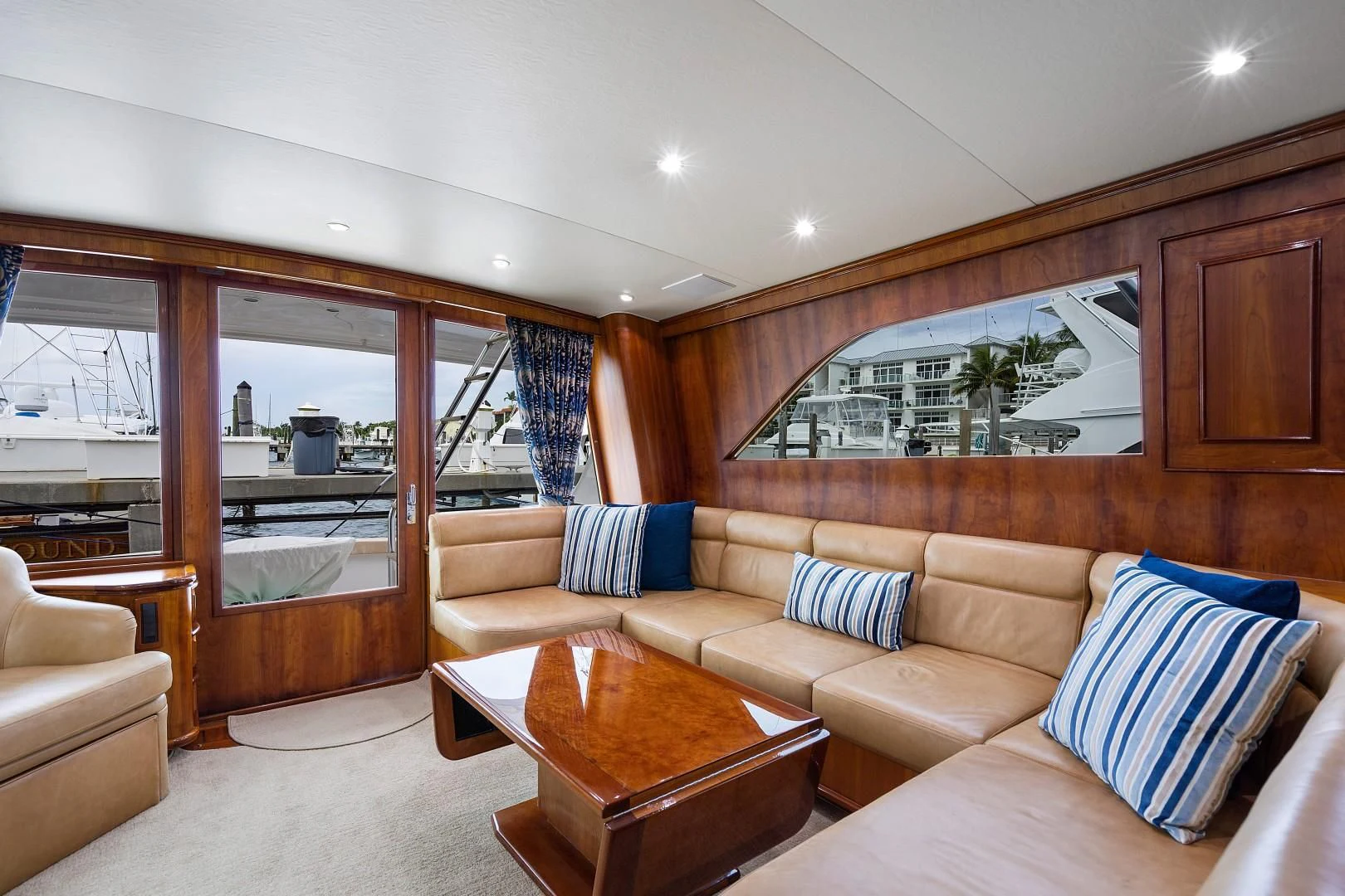 a living room with a couch and a table aboard PAST TIME Yacht for Sale