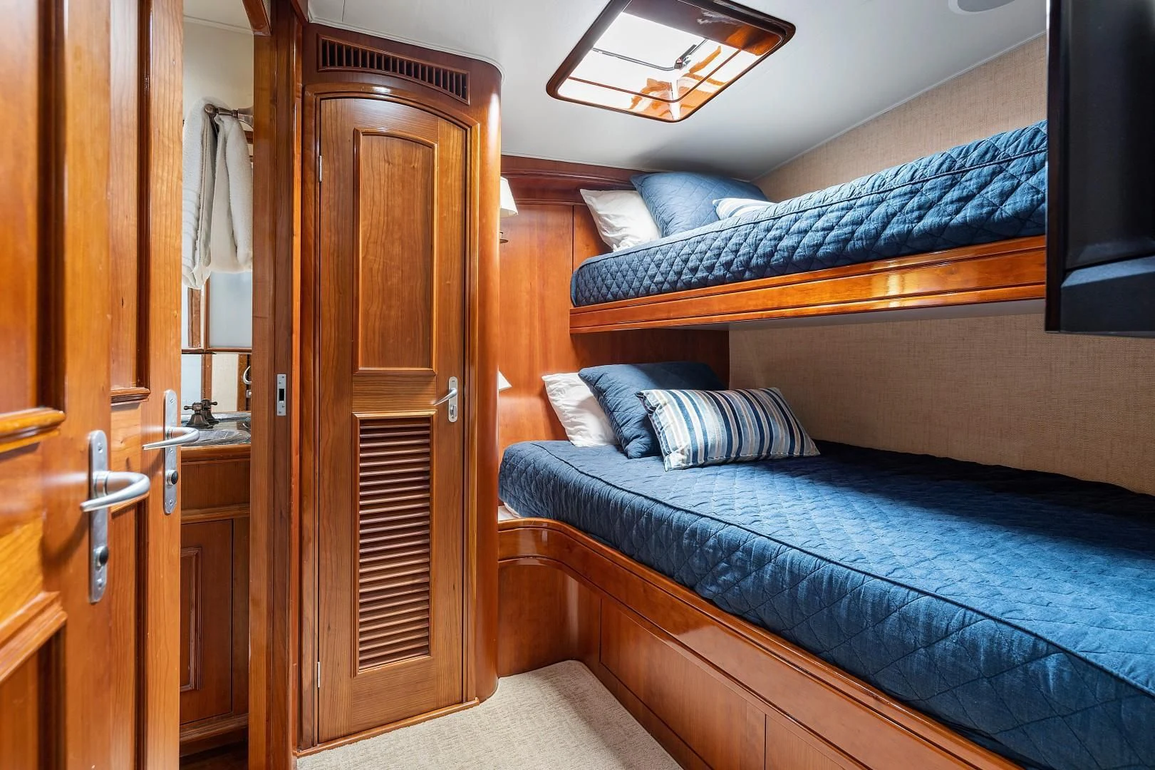 a bed in a room aboard PAST TIME Yacht for Sale