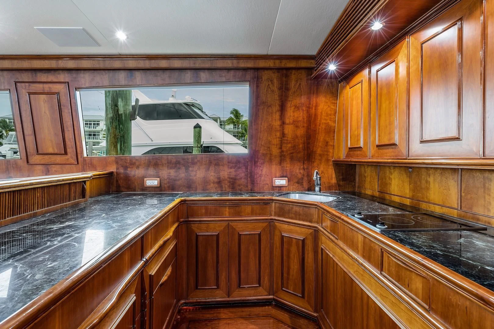 a kitchen with a large window aboard PAST TIME Yacht for Sale