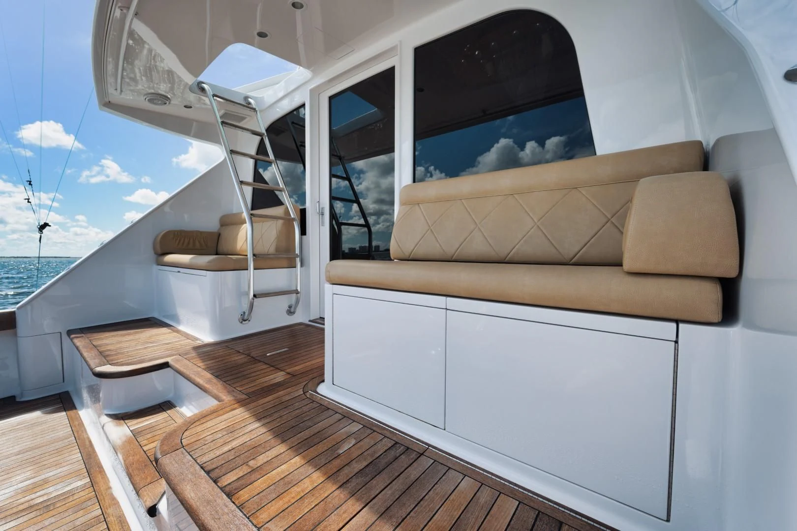 a room with a couch and a window aboard PAST TIME Yacht for Sale