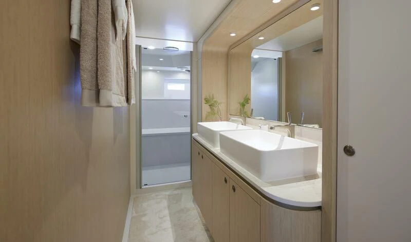a bathroom with a sink and a mirror aboard DUTCH FALCON Yacht for Sale