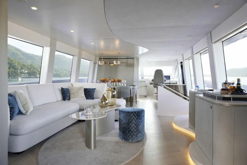 a living room with a white couch aboard DUTCH FALCON Yacht for Sale