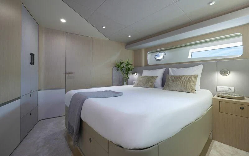 a room with a bed and a desk aboard DUTCH FALCON Yacht for Sale