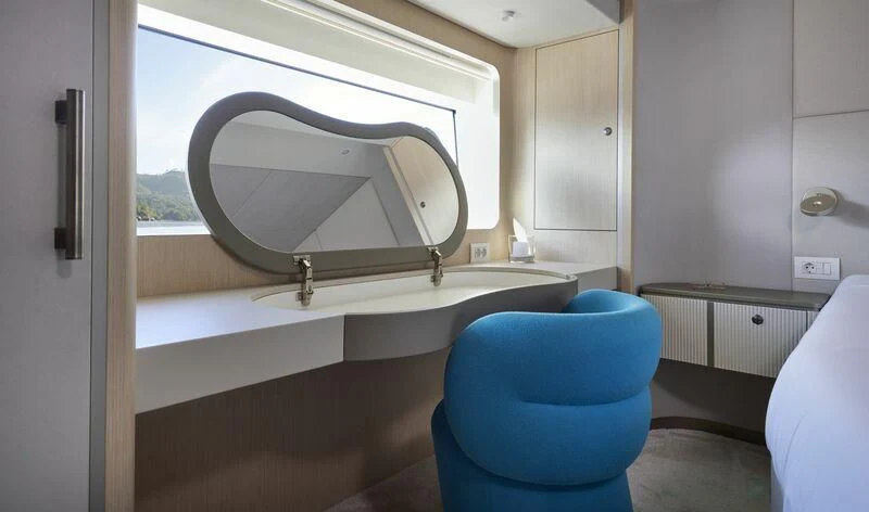 a bathroom with a round mirror aboard DUTCH FALCON Yacht for Sale
