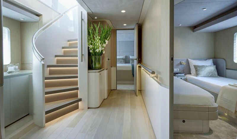 a room with a staircase and a couch aboard DUTCH FALCON Yacht for Sale