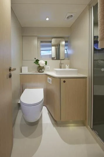 a bathroom with a toilet and a sink aboard DUTCH FALCON Yacht for Sale
