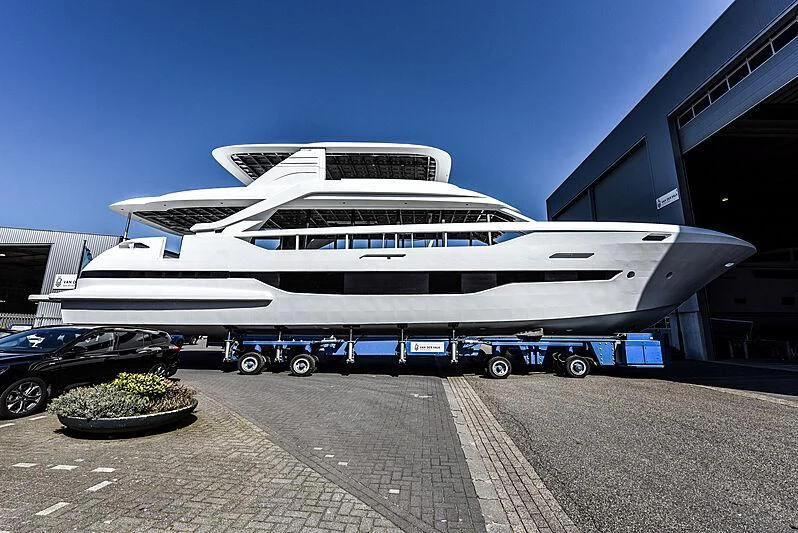a white airplane on a trailer aboard DUTCH FALCON Yacht for Sale