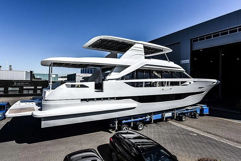 a white boat in a building aboard DUTCH FALCON Yacht for Sale