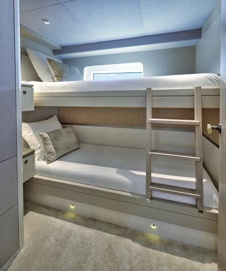 a bunk bed with a white shelf aboard DUTCH FALCON Yacht for Sale
