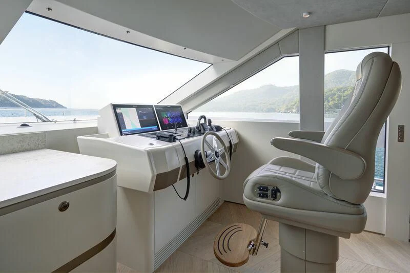 a white chair in a room aboard DUTCH FALCON Yacht for Sale