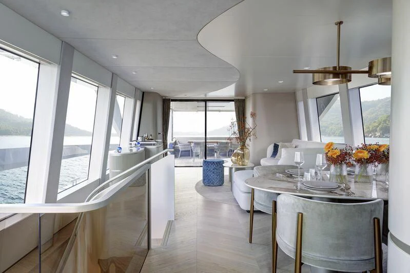 a large dining room with a large window aboard DUTCH FALCON Yacht for Sale
