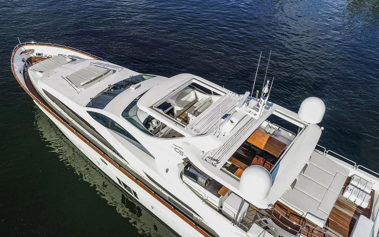 a white yacht on the water aboard INSIEME Yacht for Sale