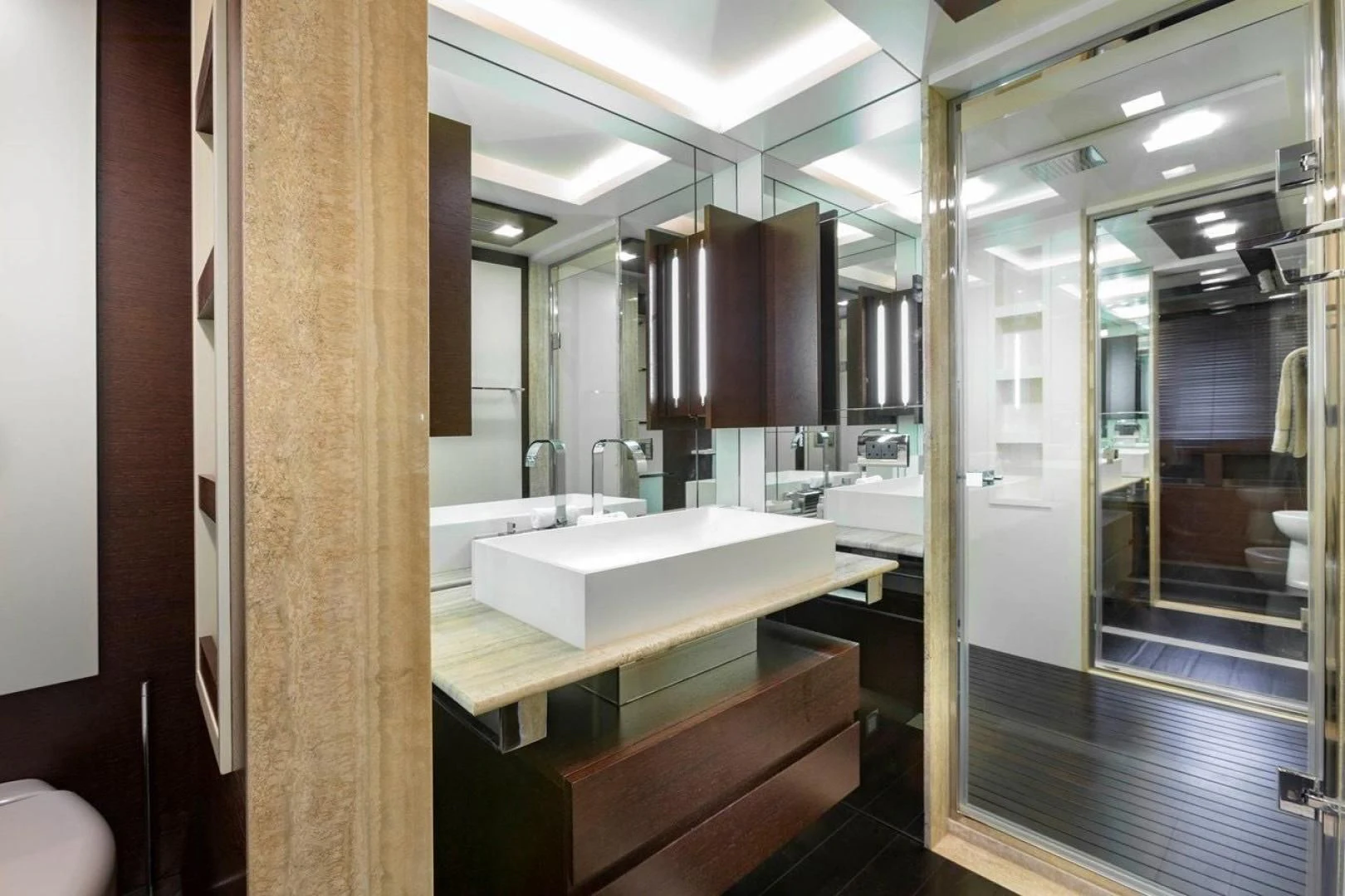 a bathroom with a large mirror aboard INSIEME Yacht for Sale