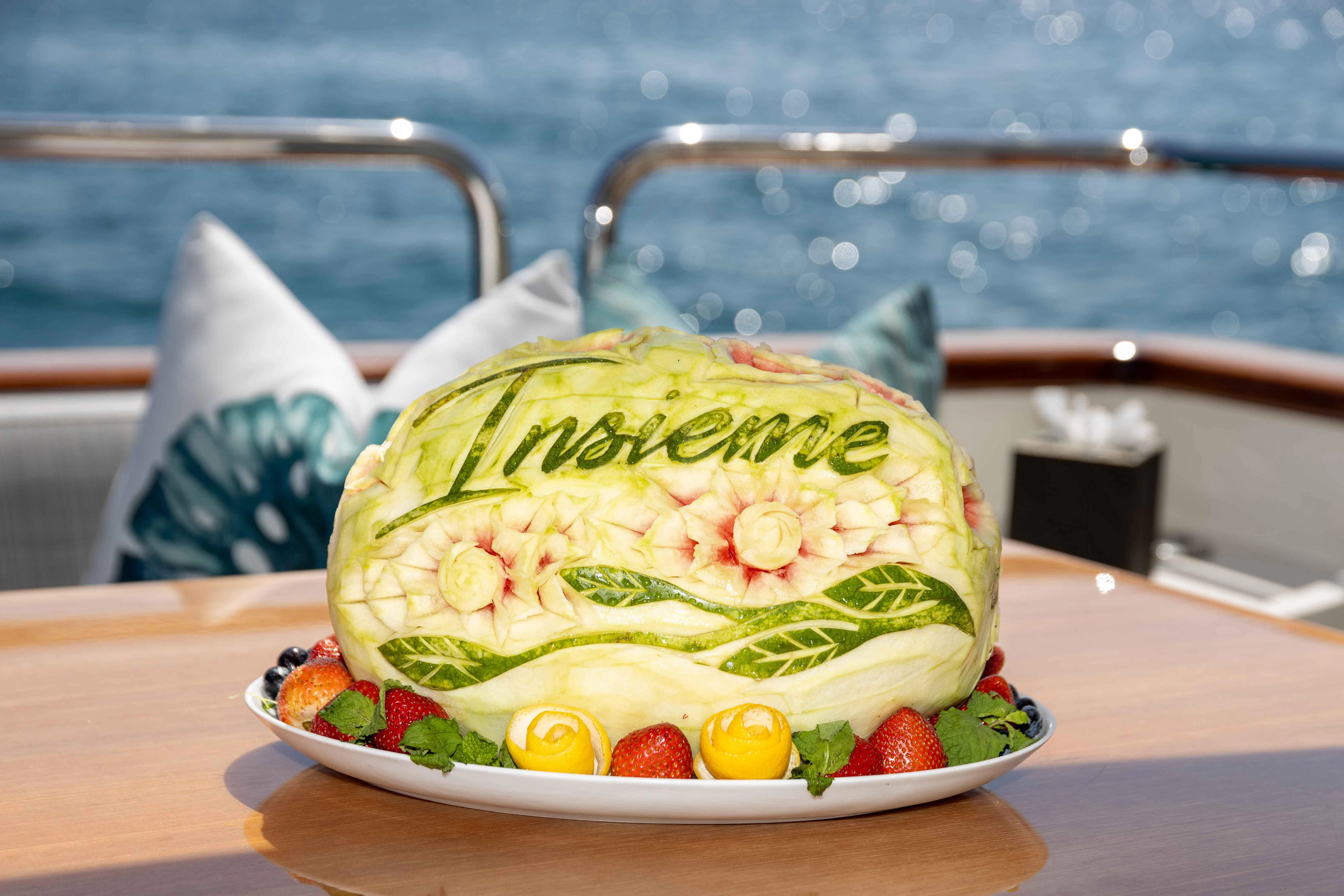 a watermelon on a plate aboard INSIEME Yacht for Sale