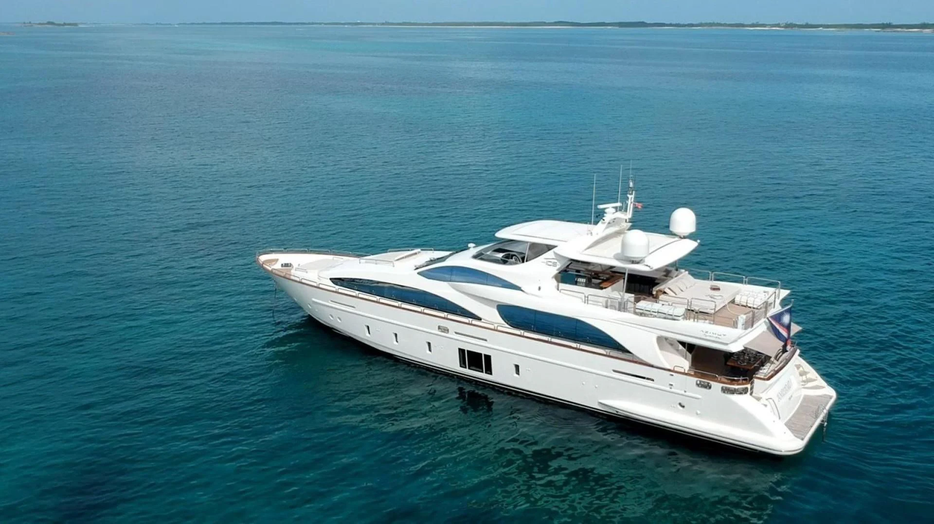 a white yacht in the water aboard INSIEME Yacht for Sale