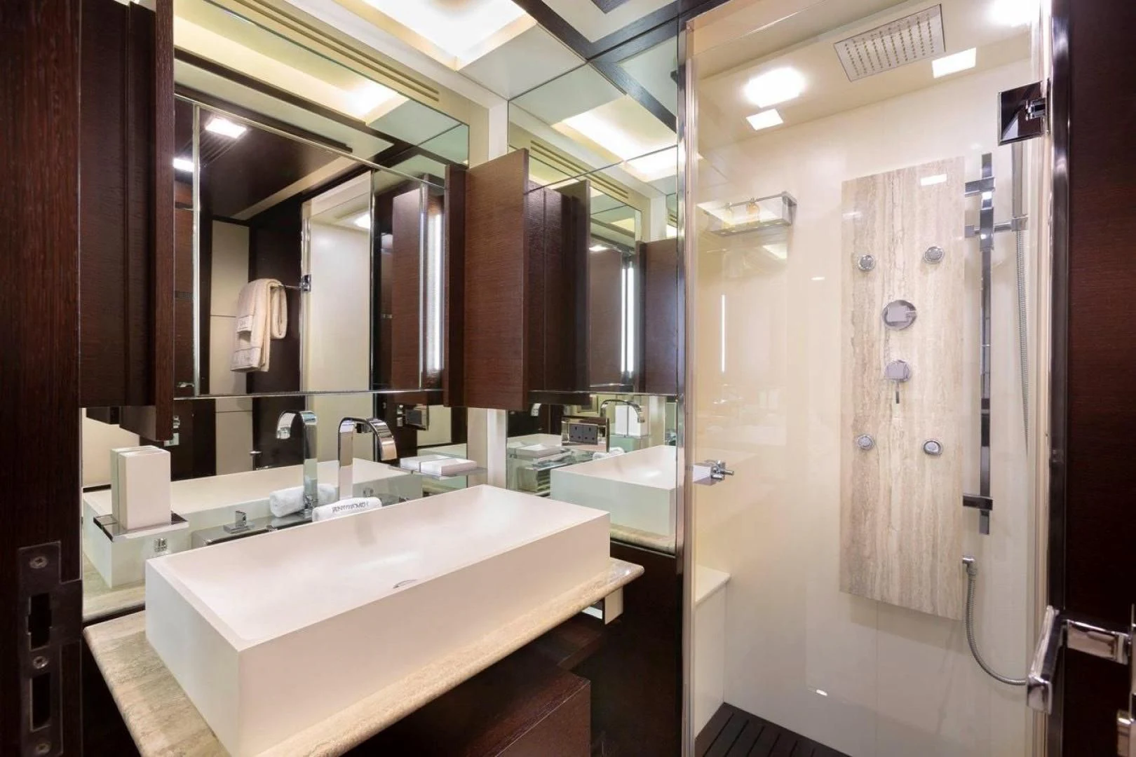a bathroom with a large mirror aboard INSIEME Yacht for Sale