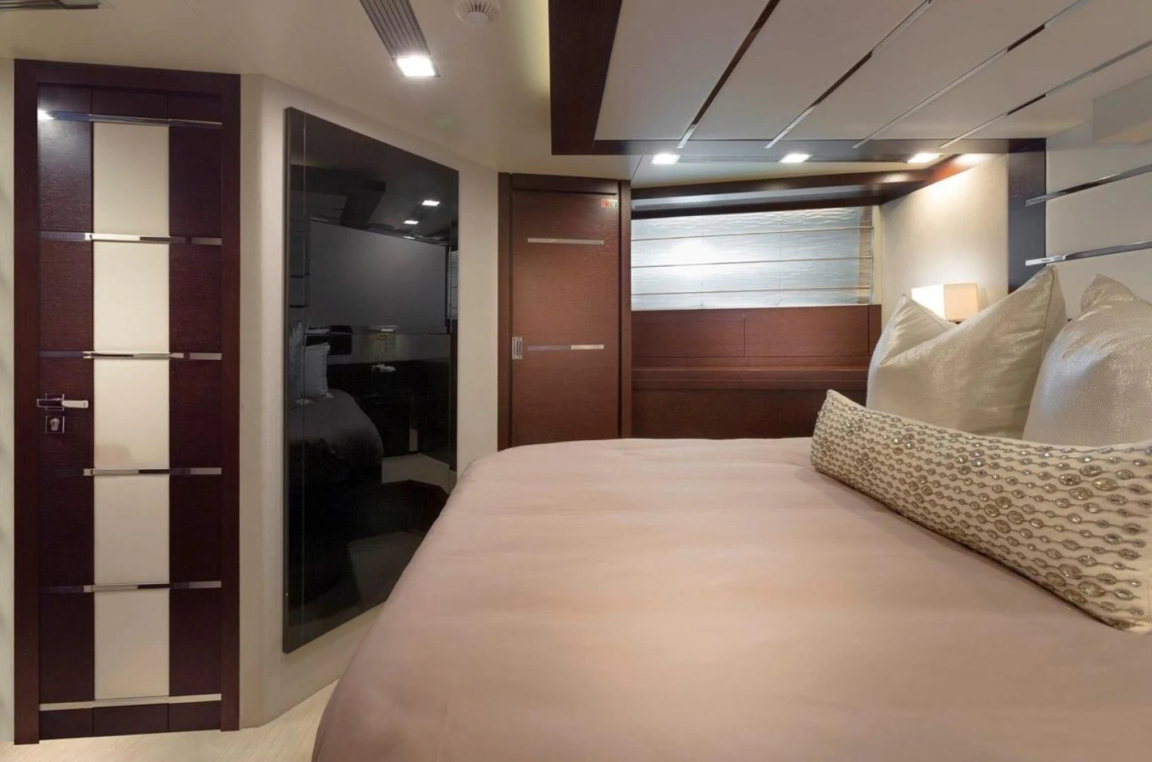 a hotel room with a bed aboard INSIEME Yacht for Sale