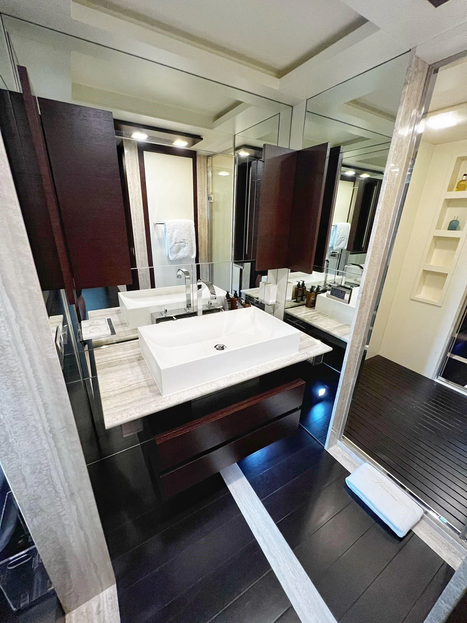 a bathroom with a large mirror aboard INSIEME Yacht for Sale