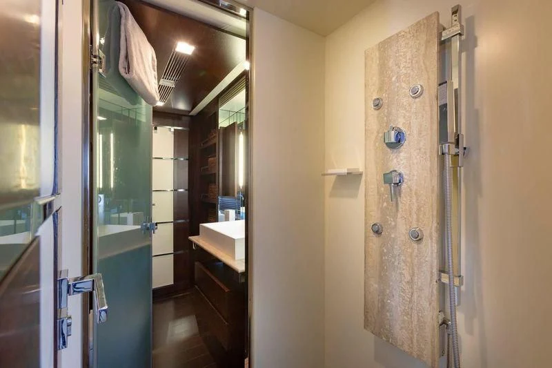 a bathroom with a shower and sink aboard INSIEME Yacht for Sale