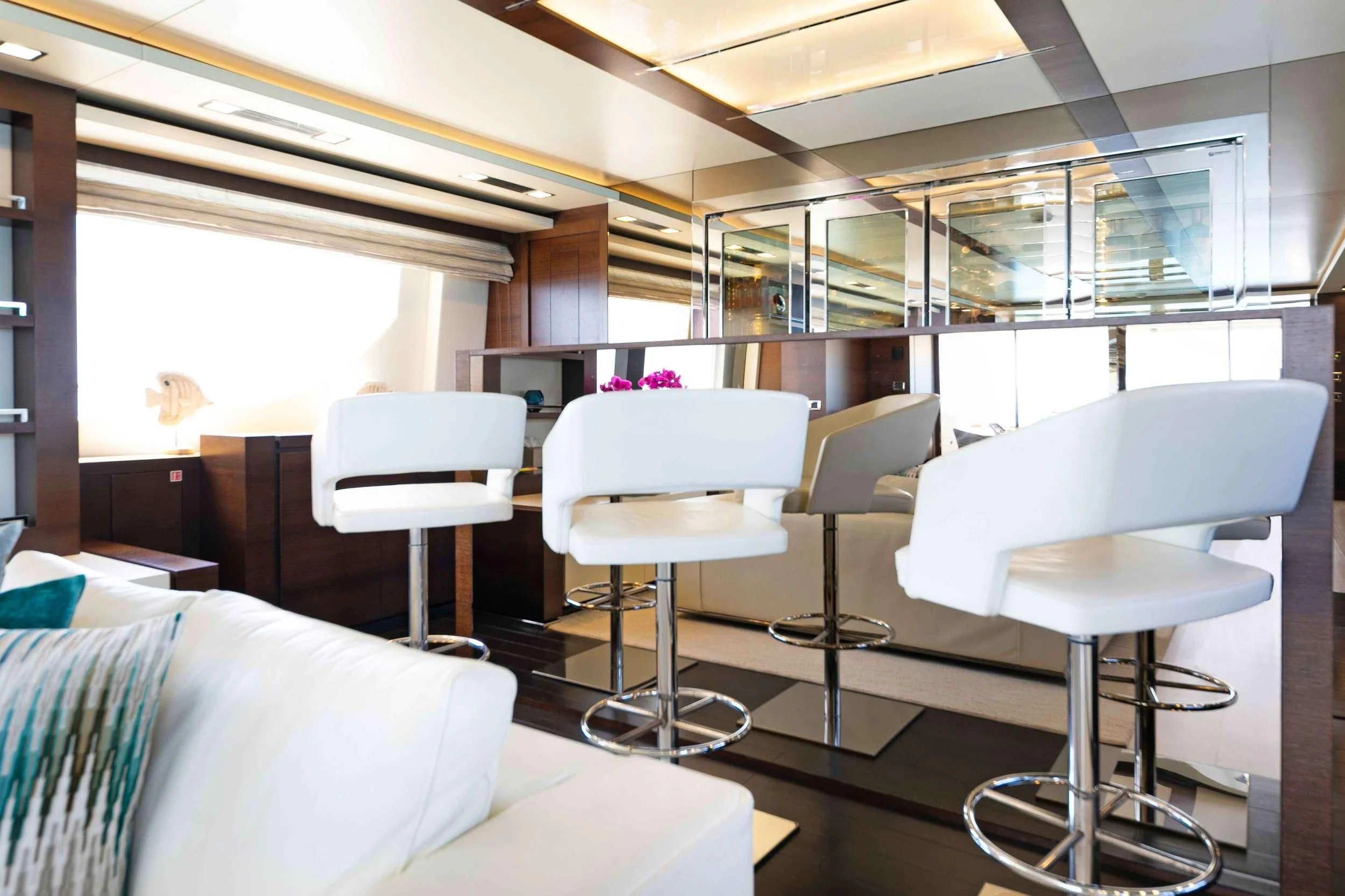 a room with chairs and tables aboard INSIEME Yacht for Sale