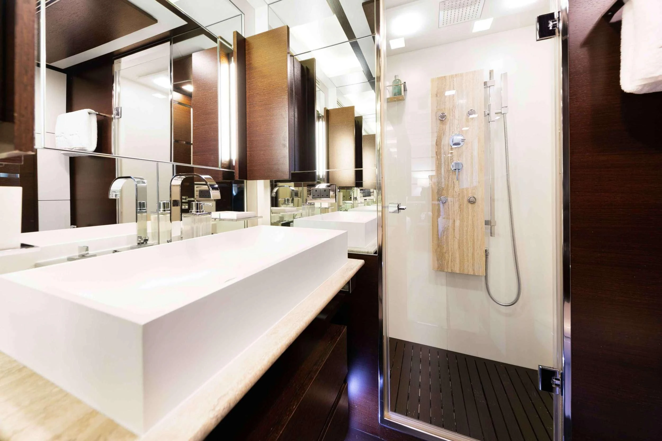a bathroom with a sink and a mirror aboard INSIEME Yacht for Sale