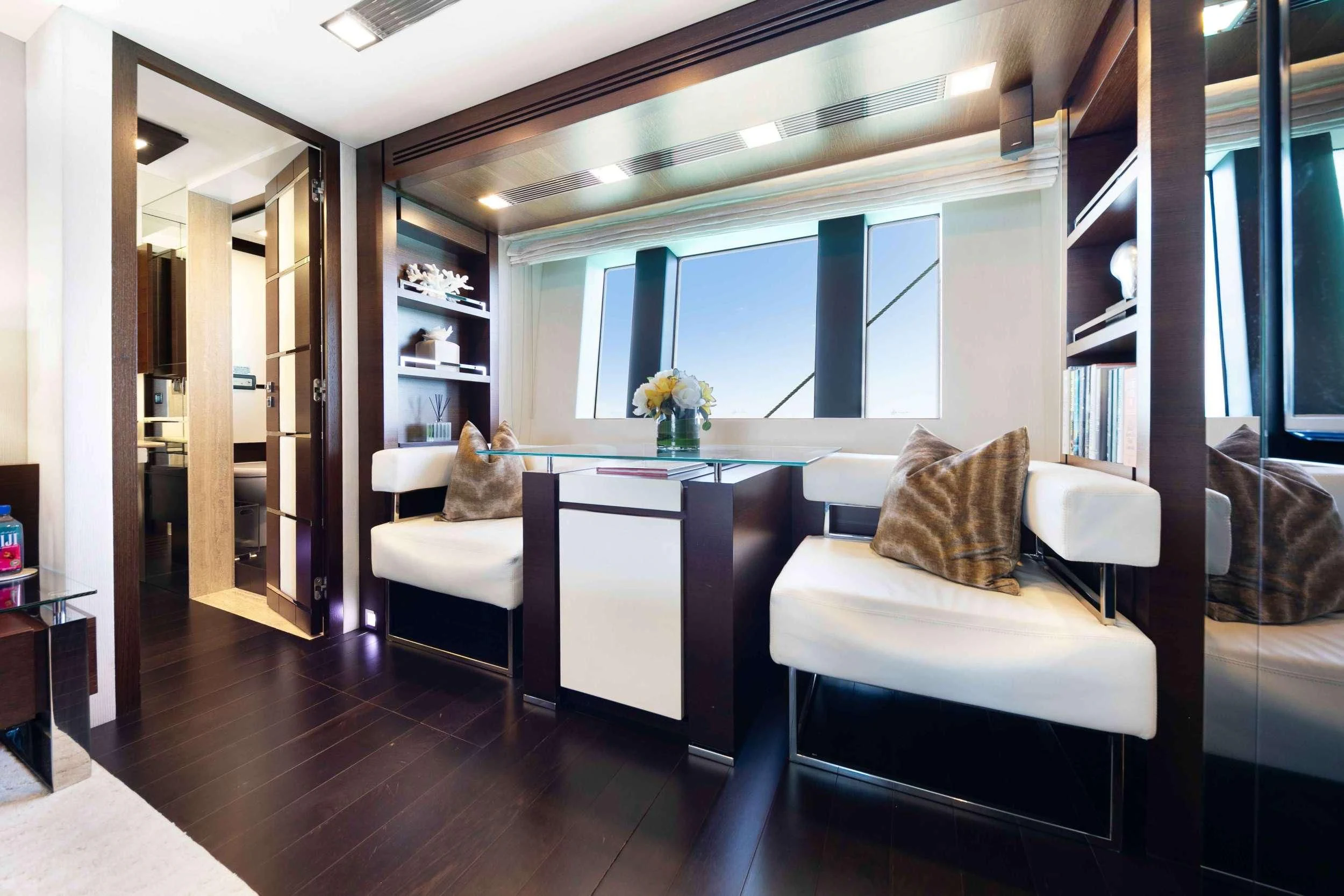 a room with a table and chairs aboard INSIEME Yacht for Sale