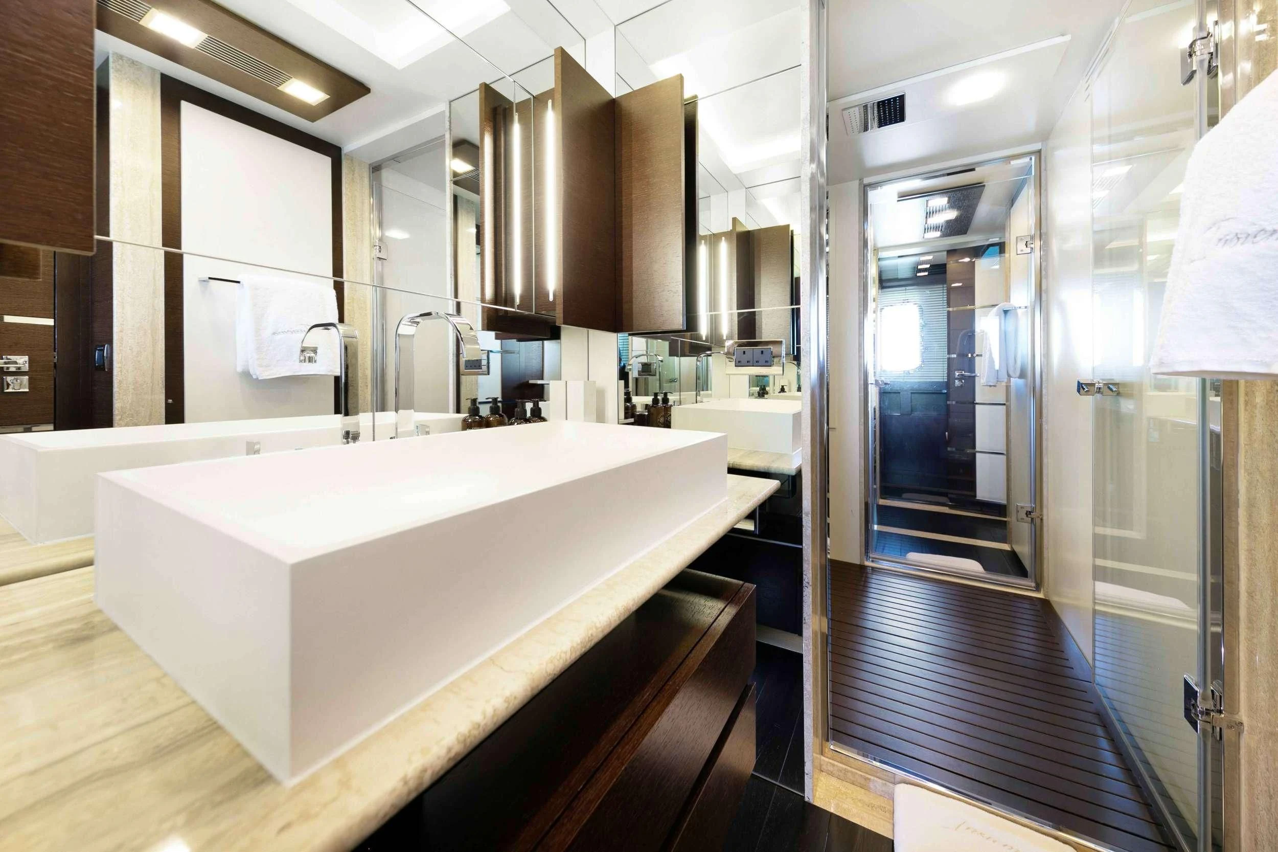 a large bathroom with a large tub aboard INSIEME Yacht for Sale