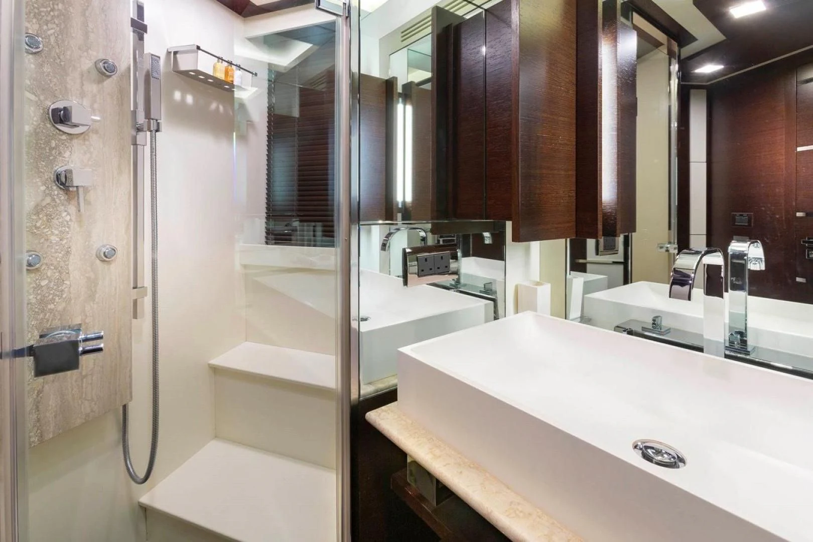 a bathroom with a large mirror aboard INSIEME Yacht for Sale