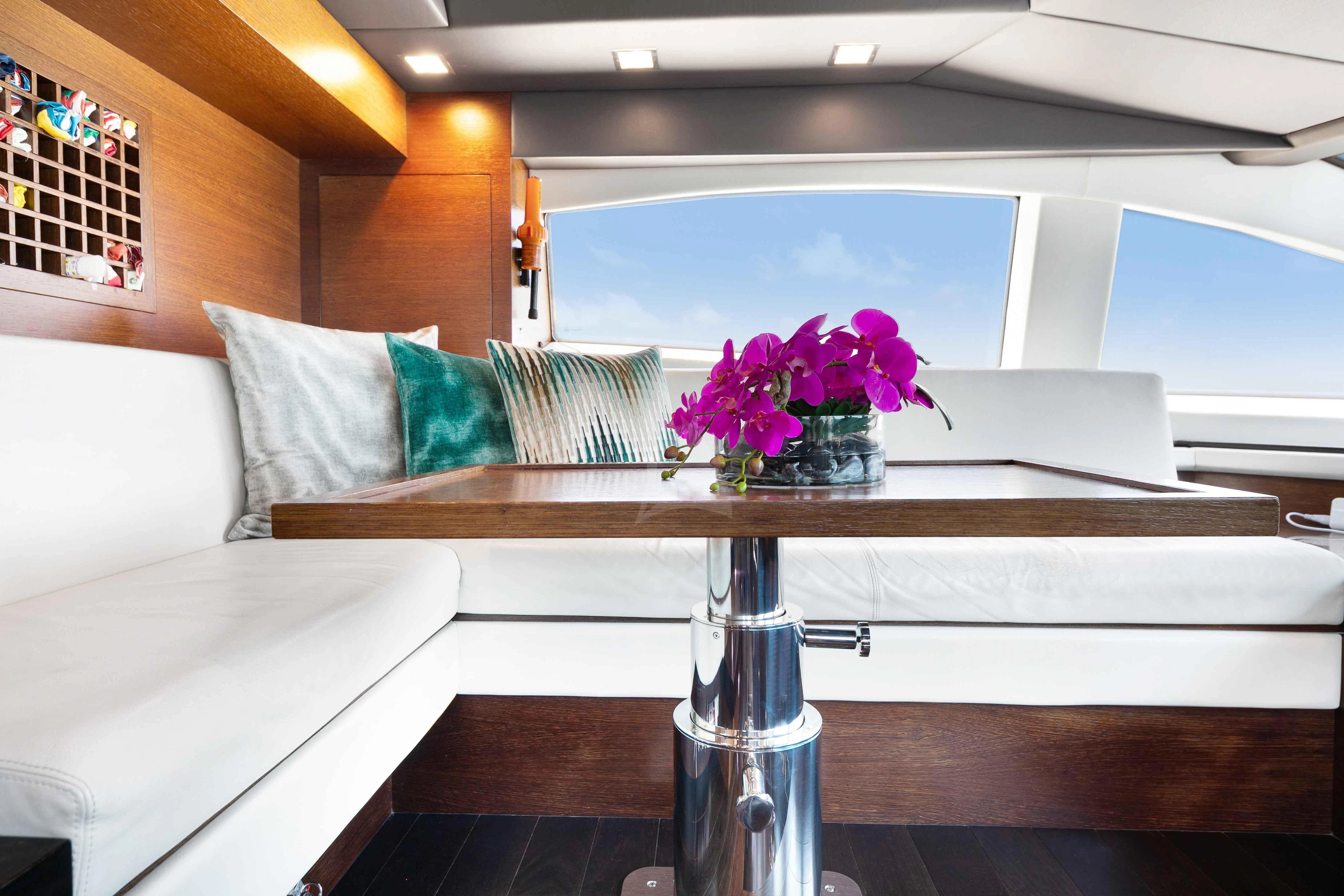 a vase of flowers on a table aboard INSIEME Yacht for Sale