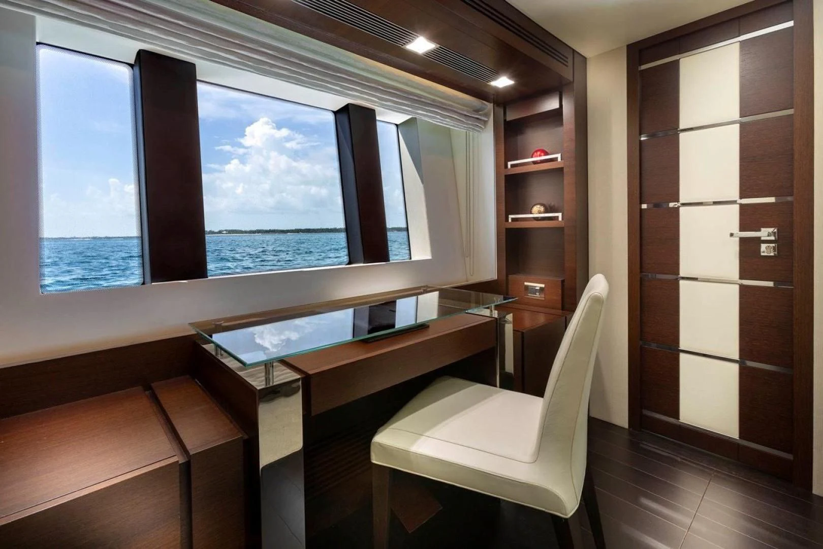 a room with a table and chairs aboard INSIEME Yacht for Sale