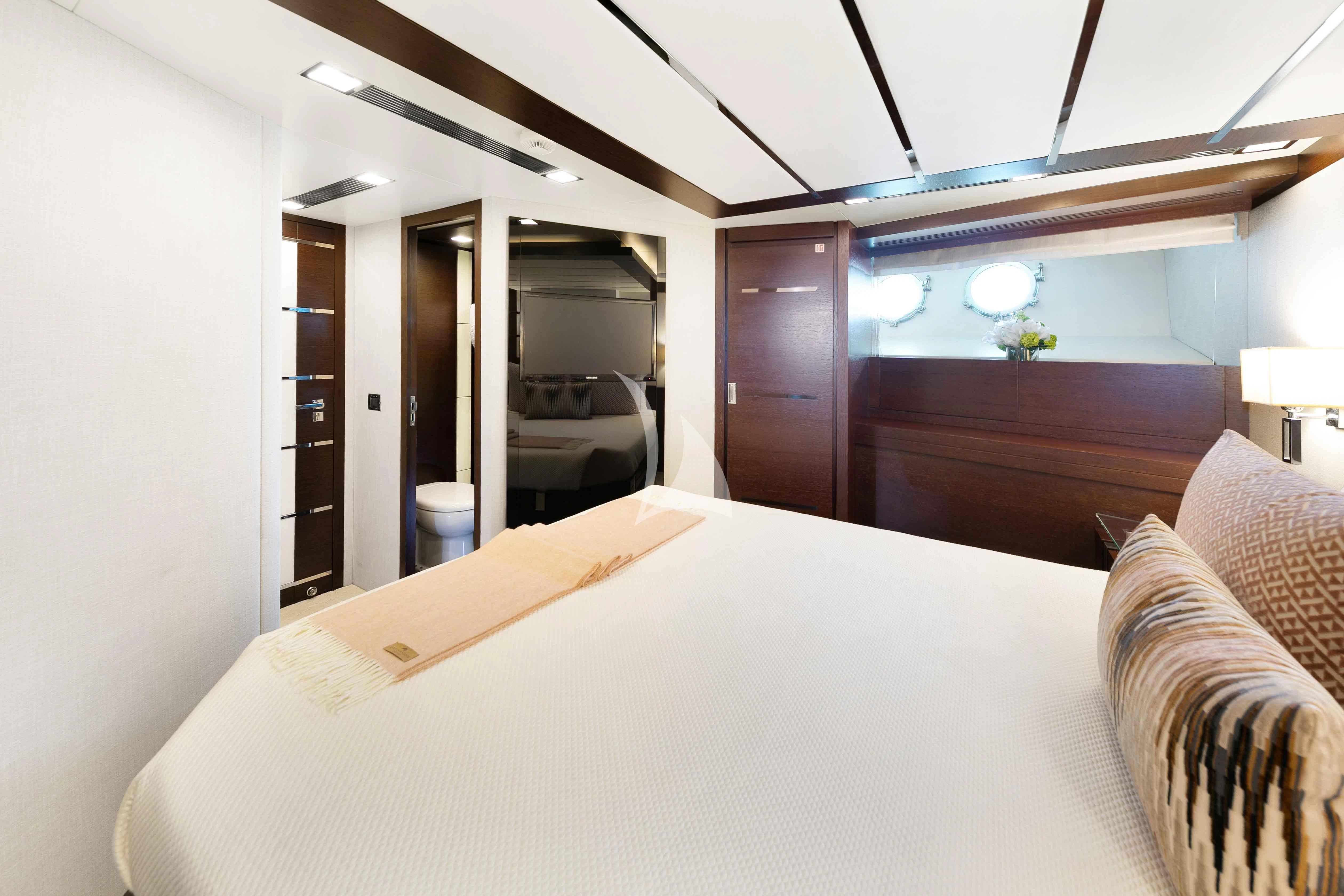 a bed in a room aboard INSIEME Yacht for Sale