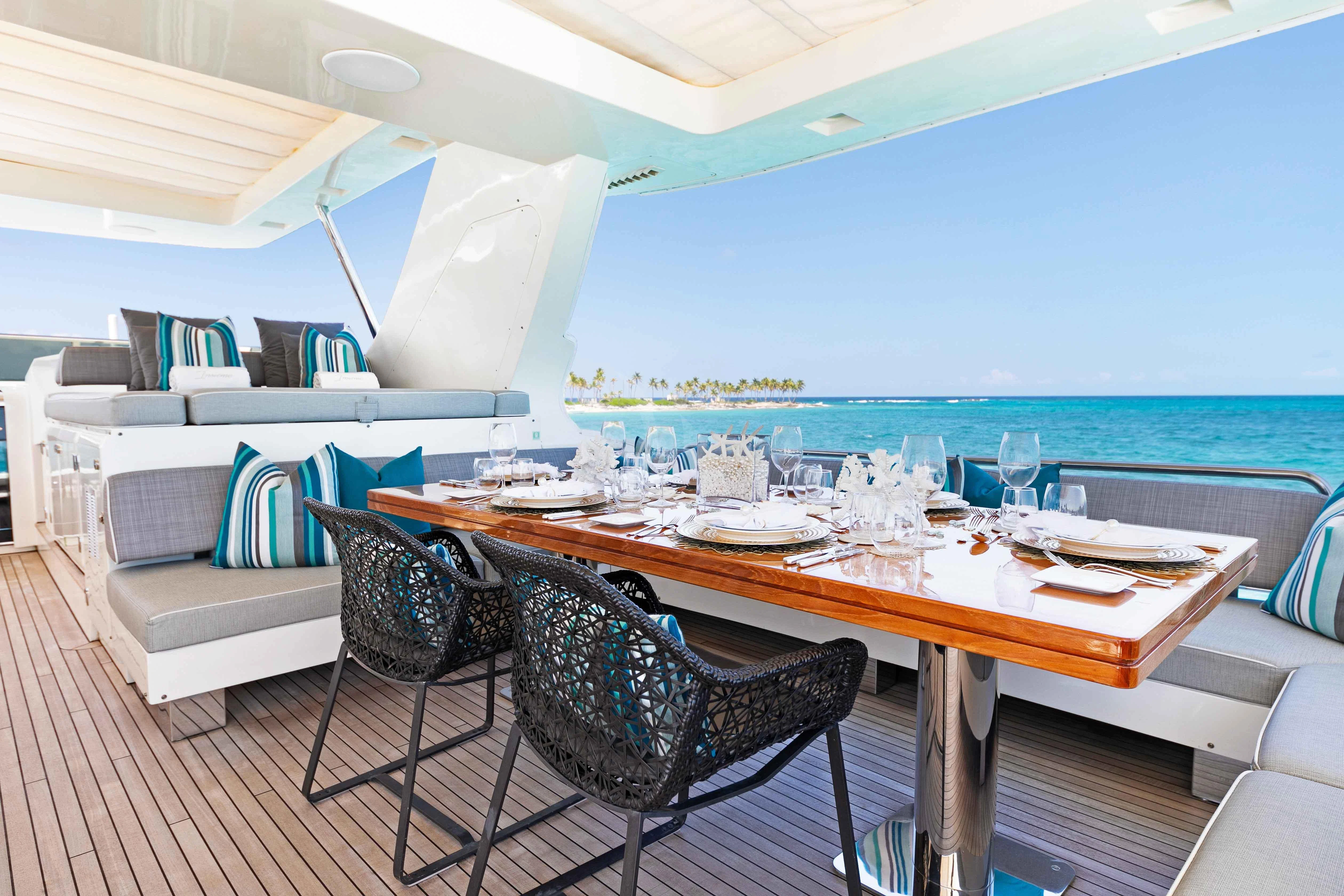 a room with a table and chairs aboard INSIEME Yacht for Sale
