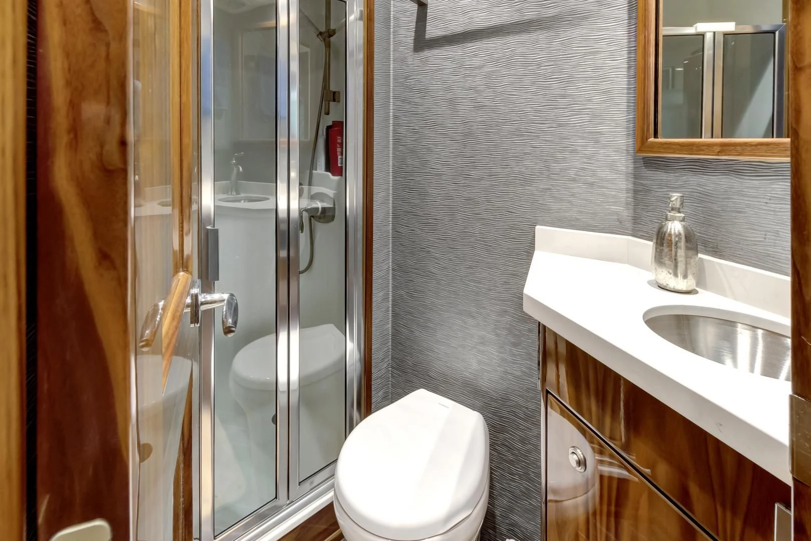 a bathroom with a shower and sink aboard POZO SECO Yacht for Sale