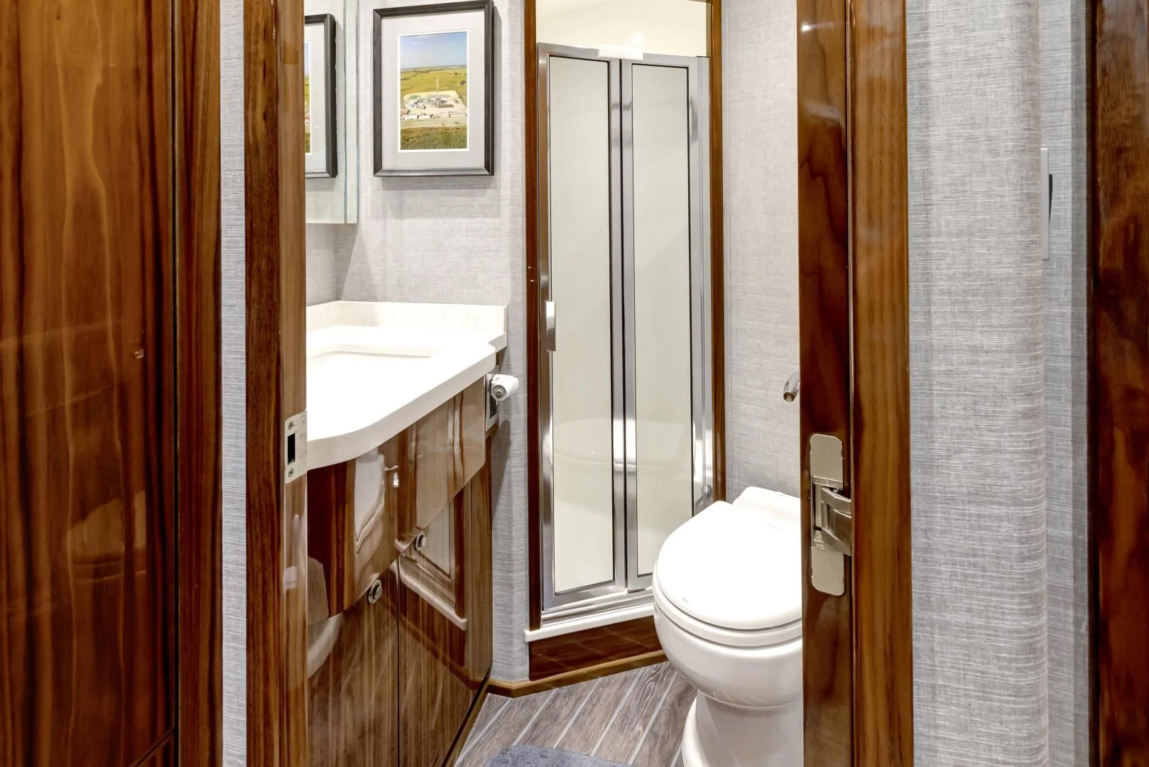 a bathroom with a toilet sink and a mirror aboard POZO SECO Yacht for Sale