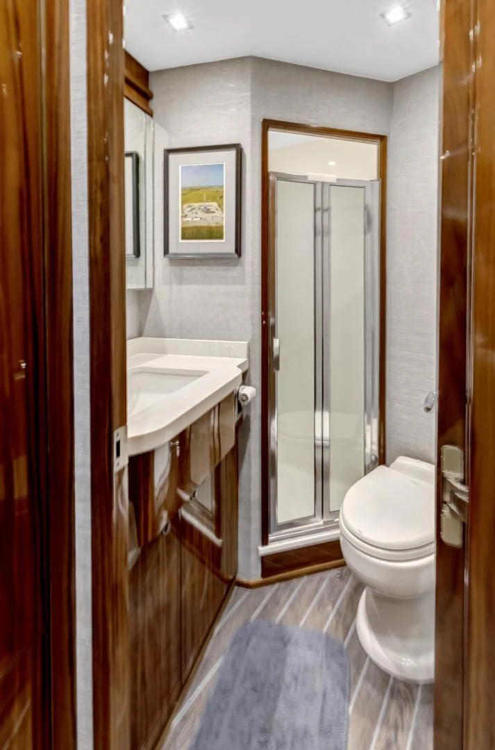 a bathroom with a toilet and sink aboard POZO SECO Yacht for Sale