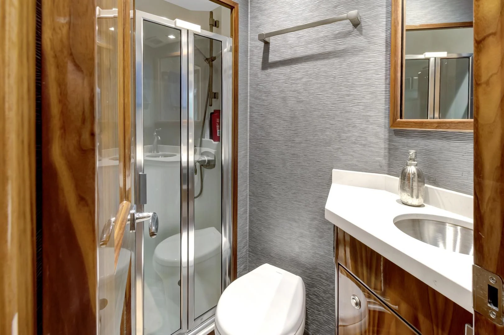 a bathroom with a glass shower aboard POZO SECO Yacht for Sale