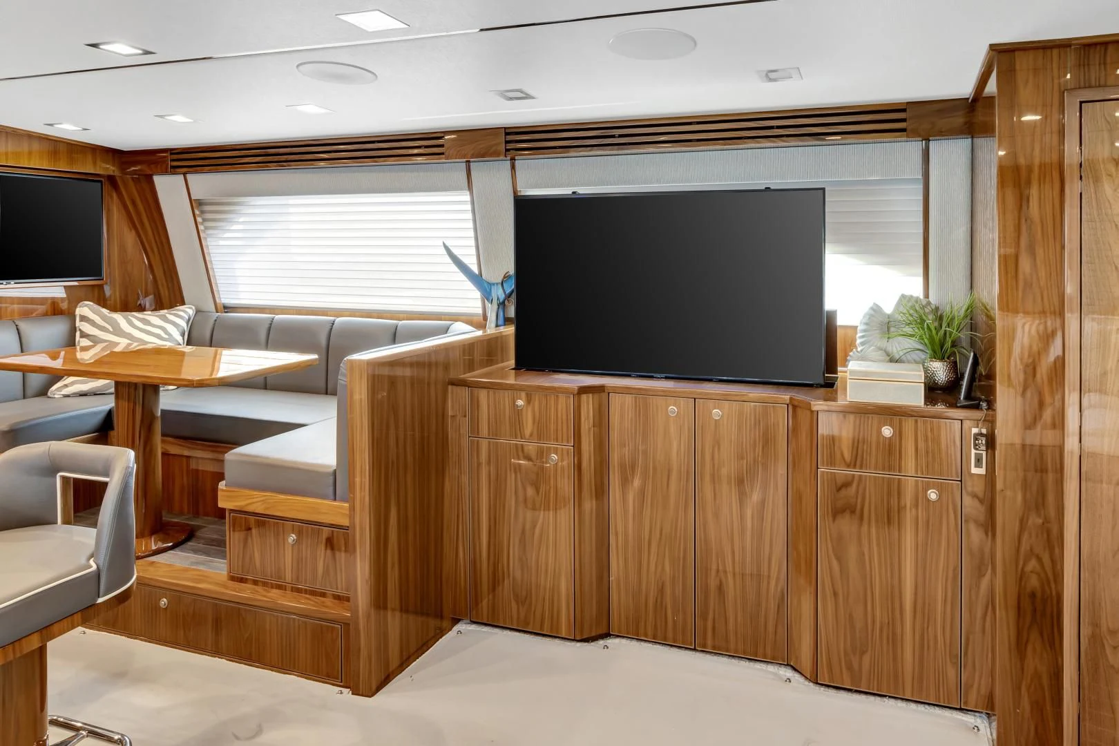 a room with a tv and a couch aboard POZO SECO Yacht for Sale