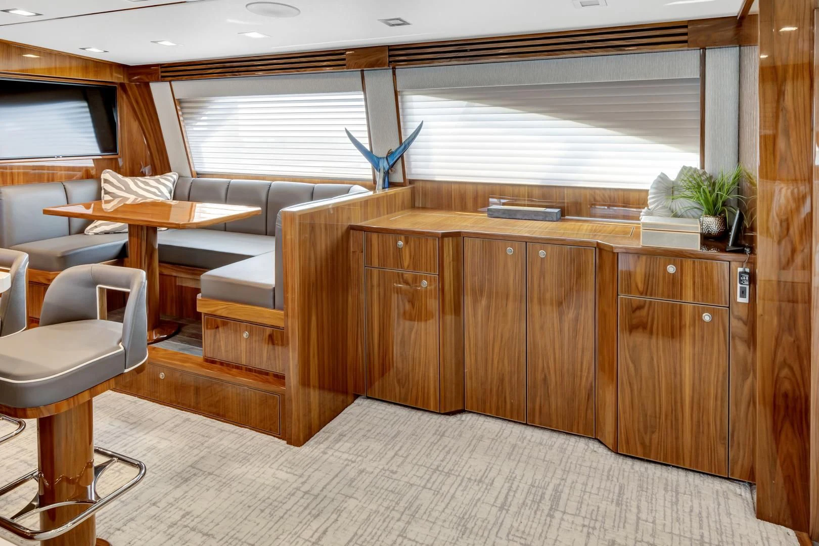 a room with a table and chairs aboard POZO SECO Yacht for Sale
