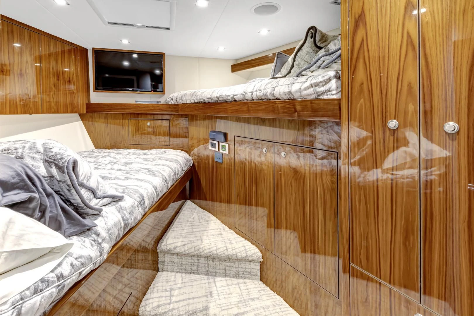 a bed with a wood wall aboard POZO SECO Yacht for Sale