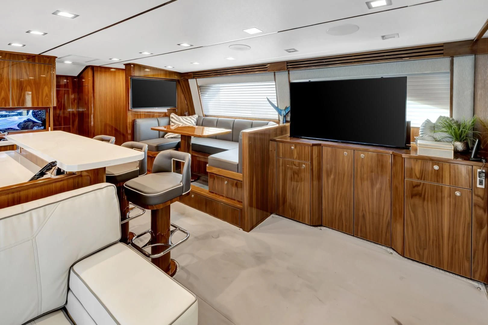 a room with a tv and desk aboard POZO SECO Yacht for Sale