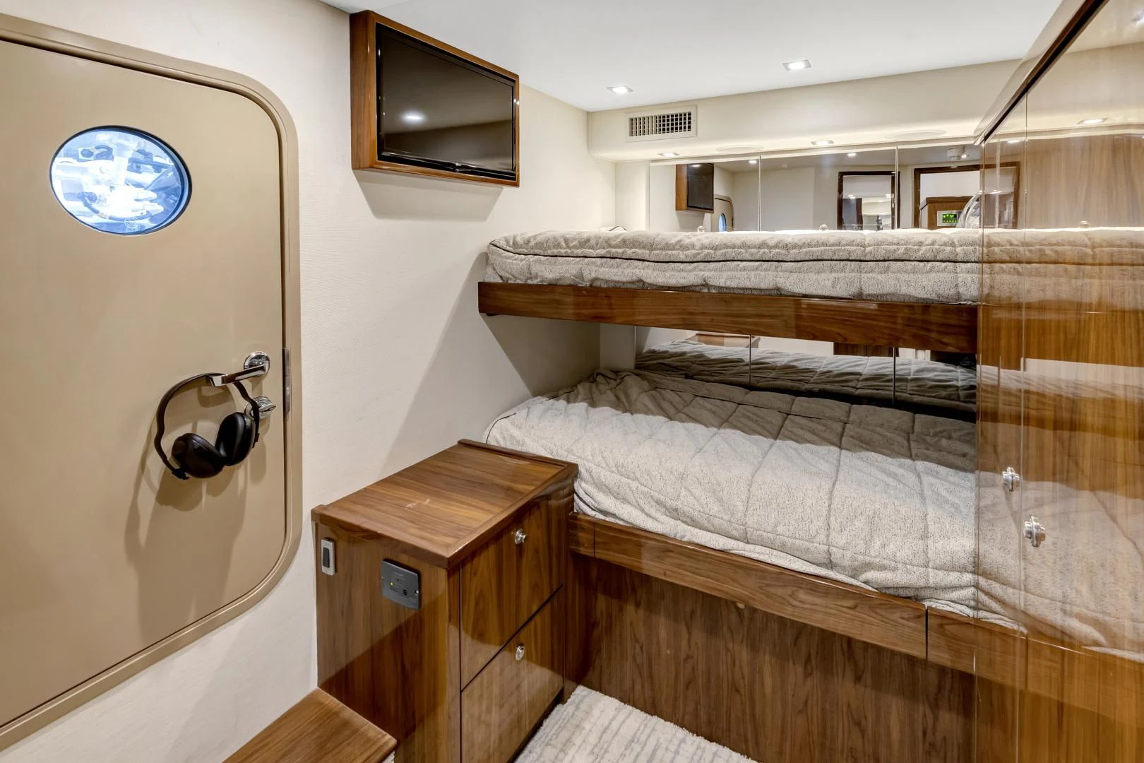 a room with a bed and a television aboard POZO SECO Yacht for Sale