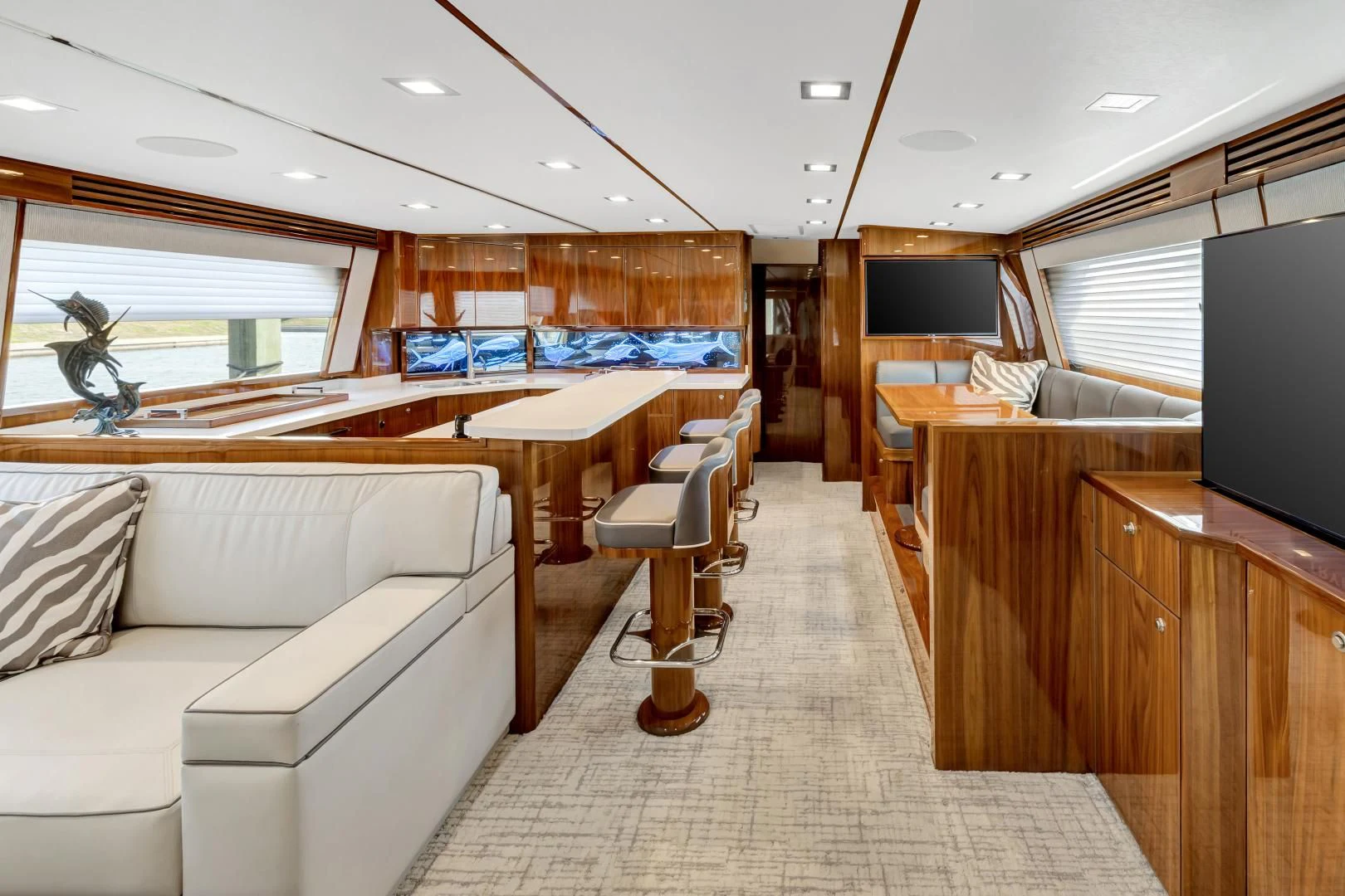 a living room with a couch and a television aboard POZO SECO Yacht for Sale