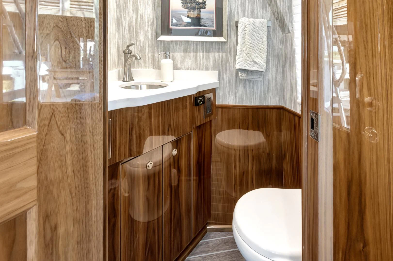a bathroom with a sink toilet and a mirror aboard POZO SECO Yacht for Sale