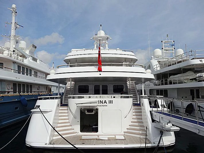 a large white boat in a harbor aboard ATHINA III Yacht for Sale