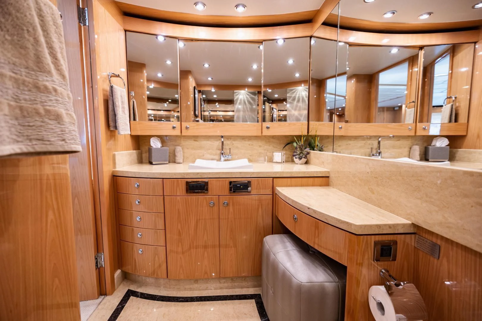 a bathroom with wooden cabinets aboard PINGUINITO Yacht for Sale