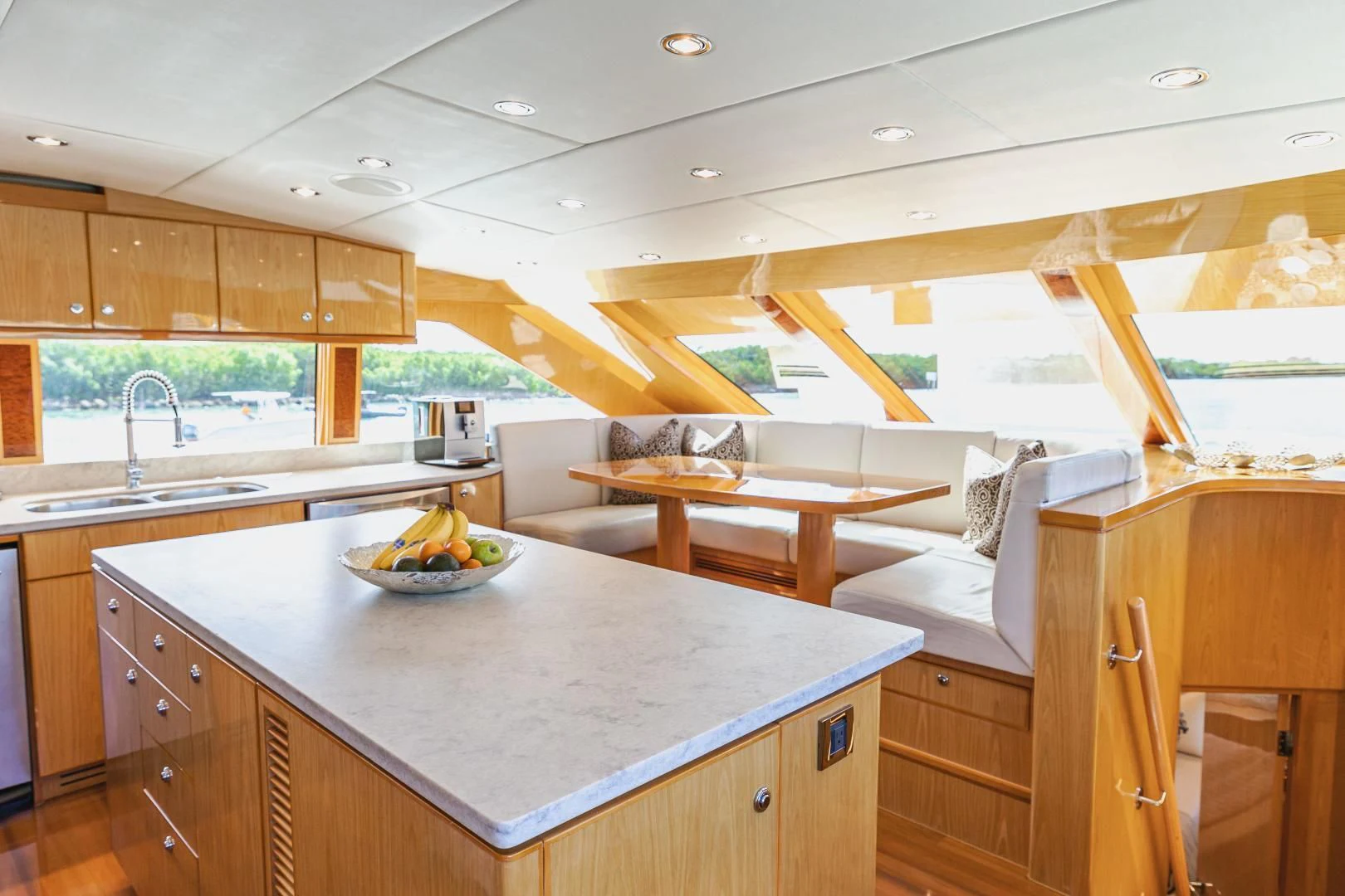 a kitchen with a large island aboard PINGUINITO Yacht for Sale