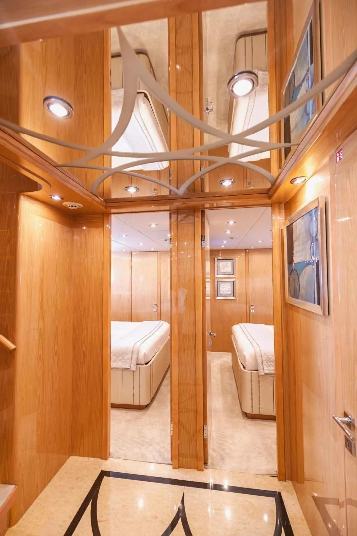 a bathroom with a large mirror aboard PINGUINITO Yacht for Sale