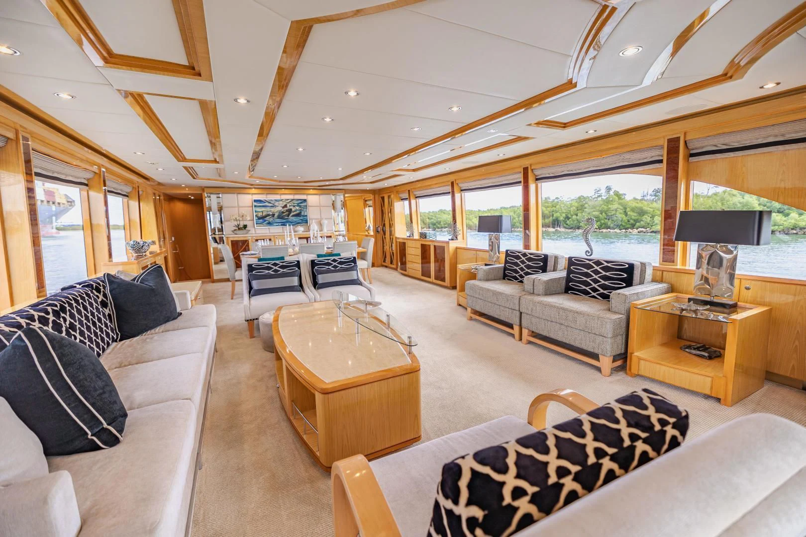 a living room with a large window aboard PINGUINITO Yacht for Sale