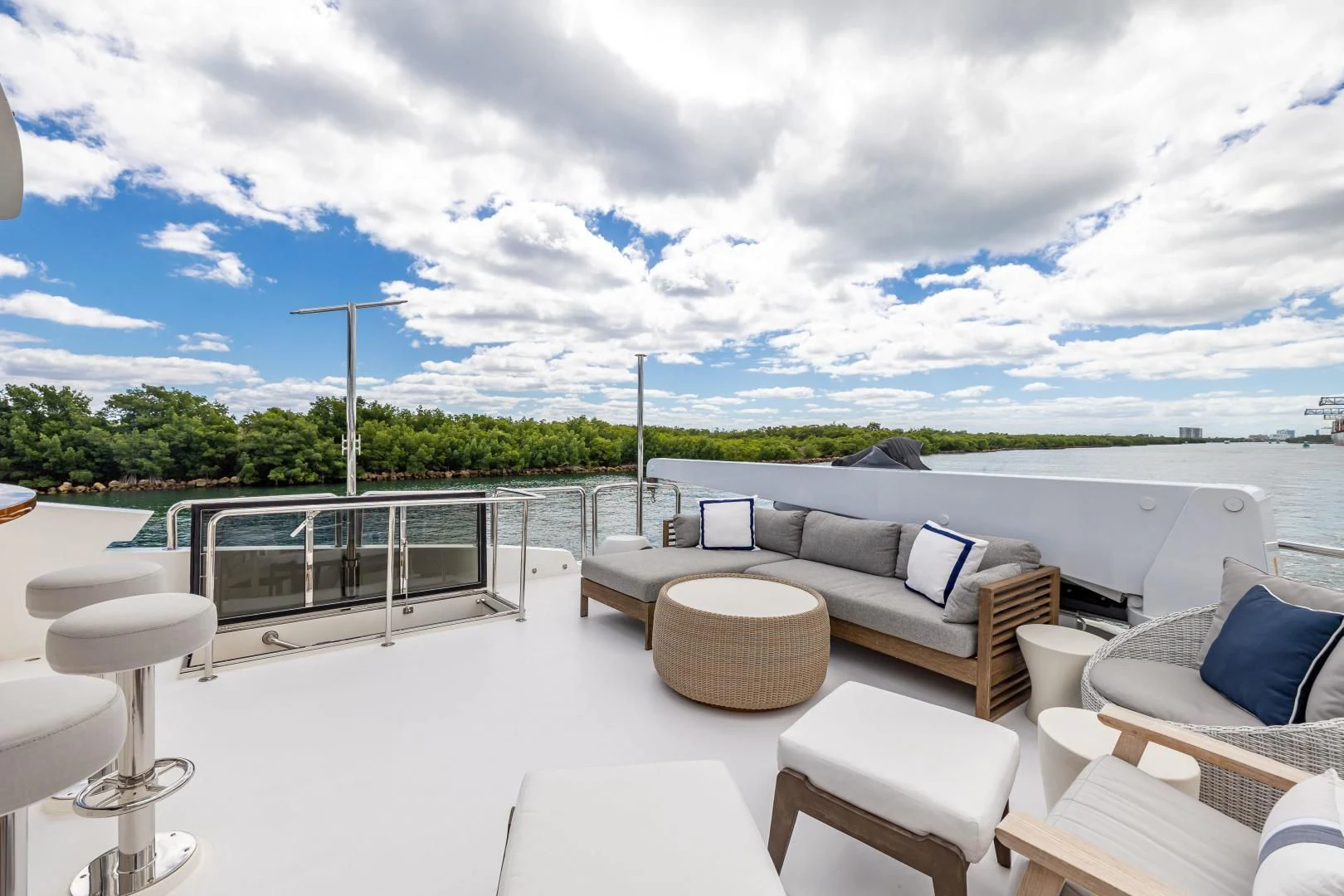 a patio with chairs and a large body of water aboard PINGUINITO Yacht for Sale